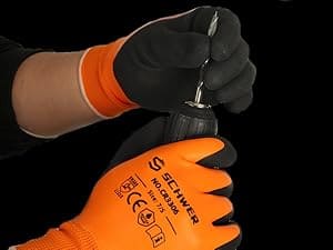 Person wearing orange gloves with 'Secumar' branding holding a tool against a black background