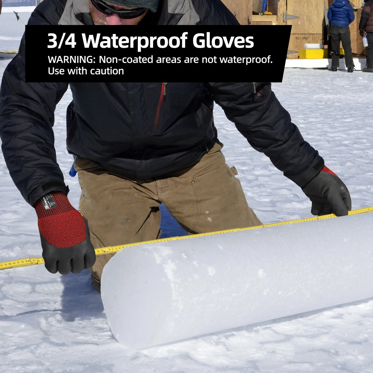 Person wearing 3/4 waterproof gloves measuring a large ice block outdoors in snowy setting