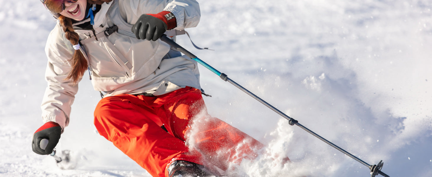 Person skiing in the snow with a focus on action and movement.