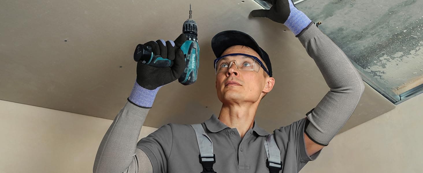 Person using a drill on a ceiling
